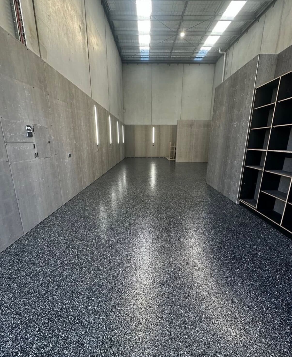 Industrial warehouse with dark blue-grey epoxy